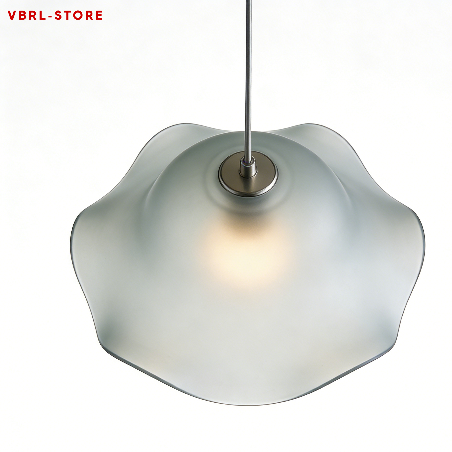 Wavy-edged pendant lamp hanging in modern living room