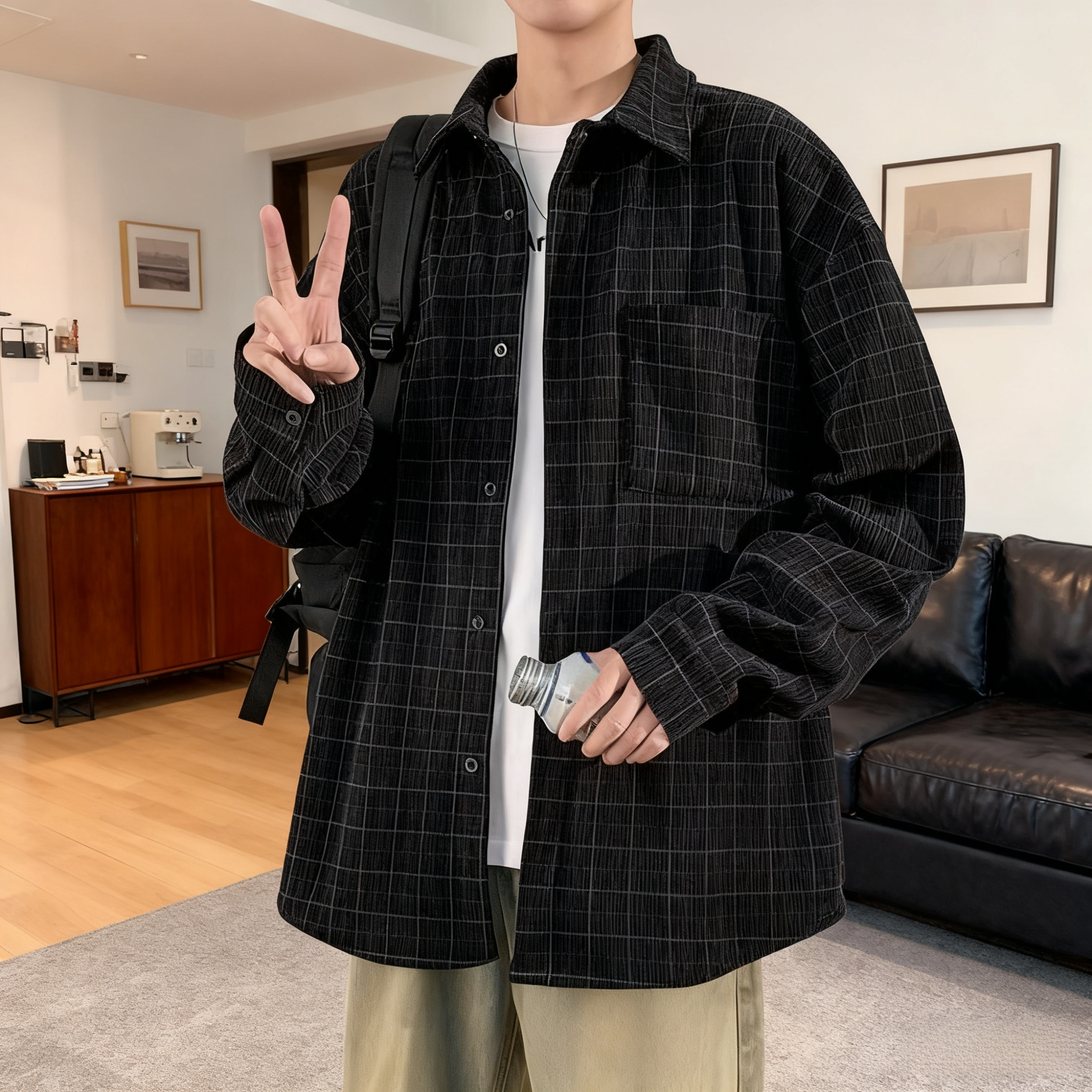 Close-up of corduroy fabric and plaid pattern on men's shirt jacket